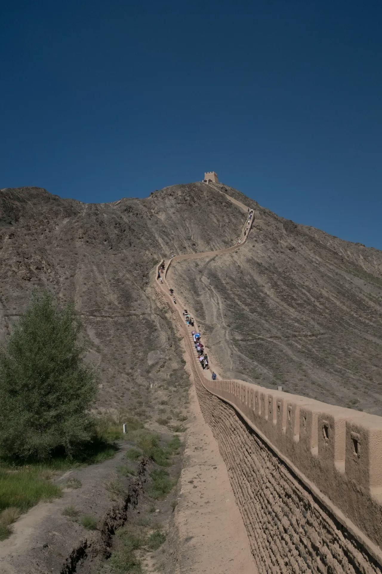 The great wall through the desert and over mountains - Gansu, China